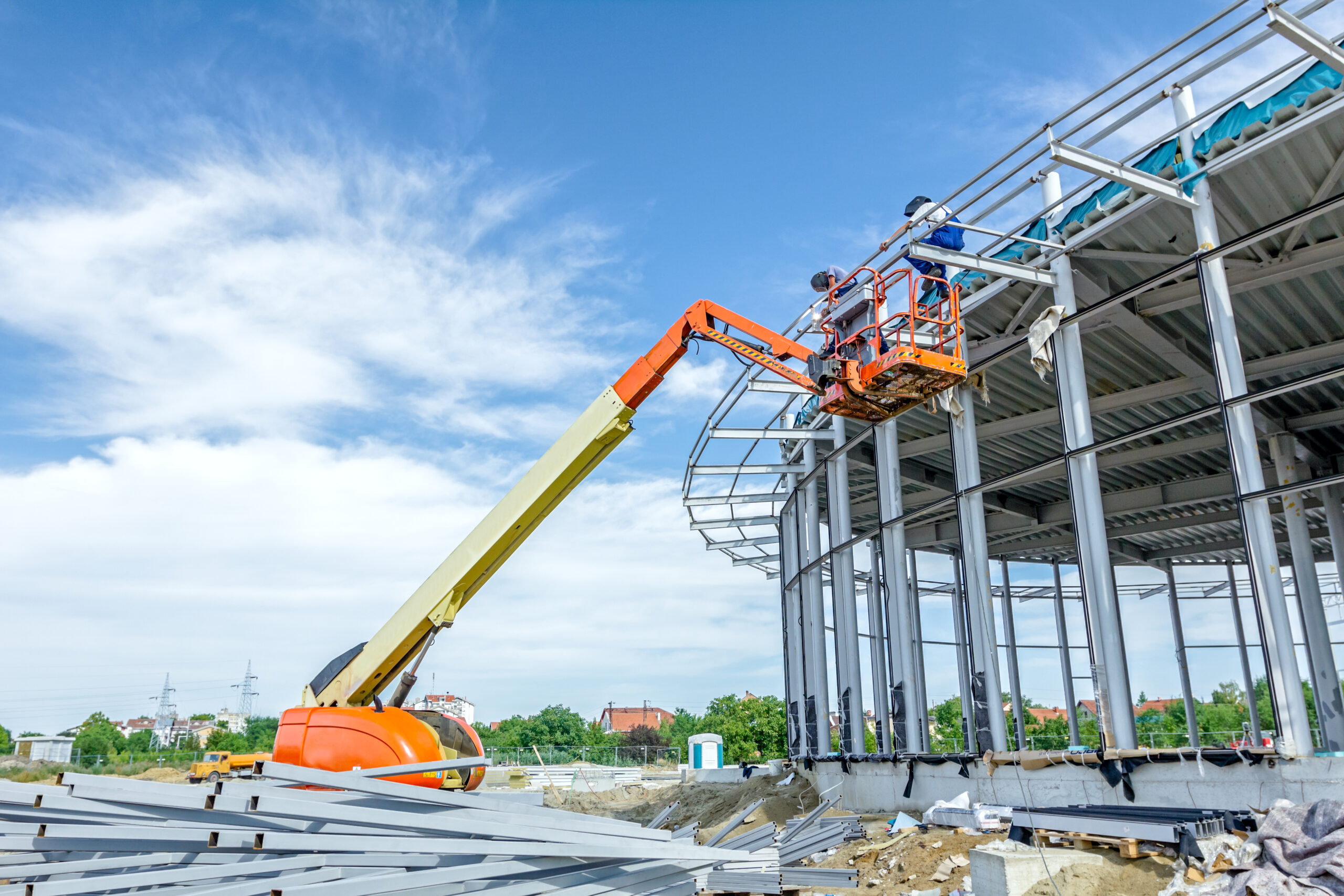 height workers with help of cherry picker are working.